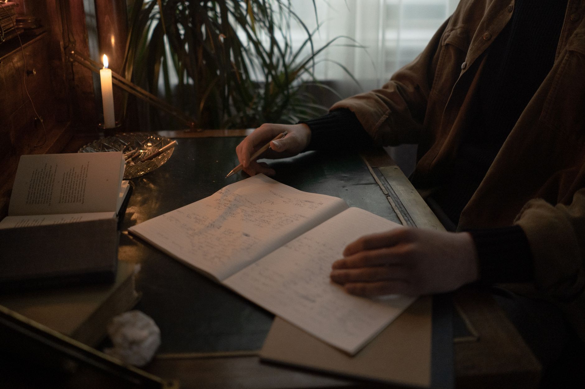 Dark notebook and pen, similar to the Death Note ritual object