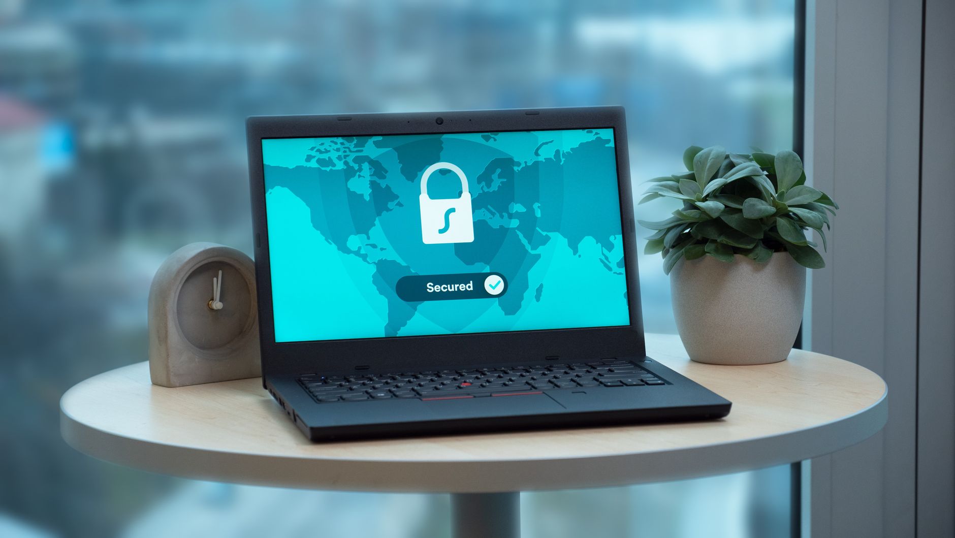 Padlock icon over a laptop keyboard, symbol of data privacy